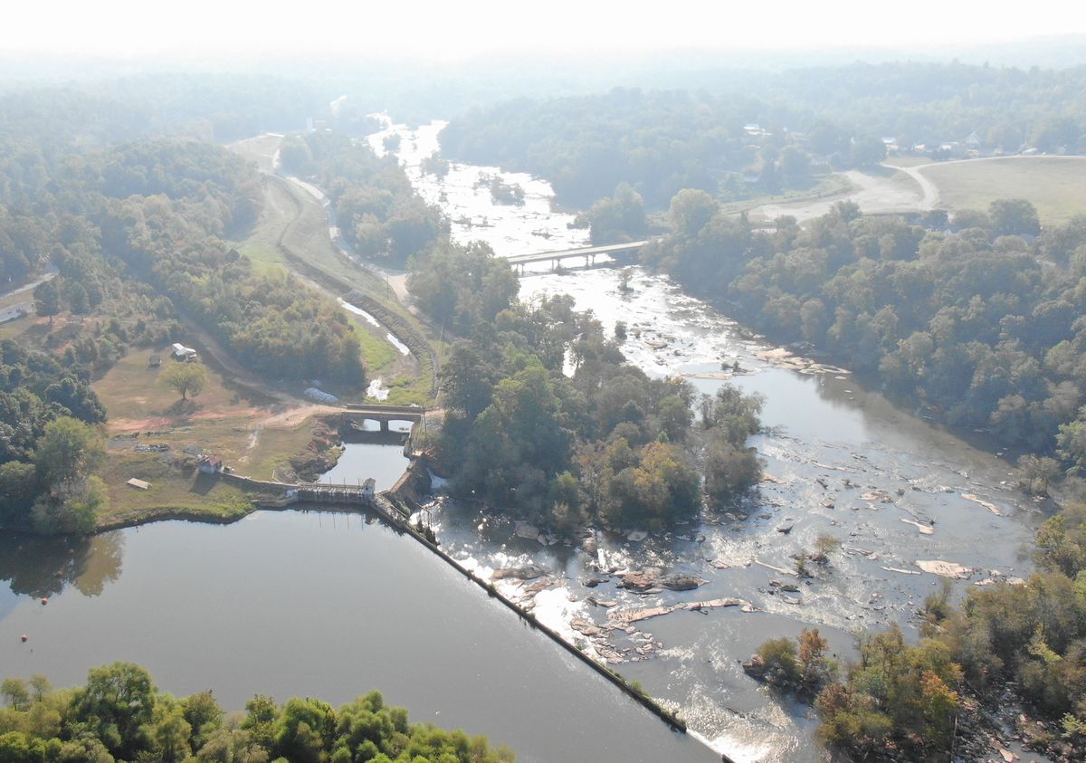 Close aerial view of the Ware Shoals dam, spillway, and surrounding forest